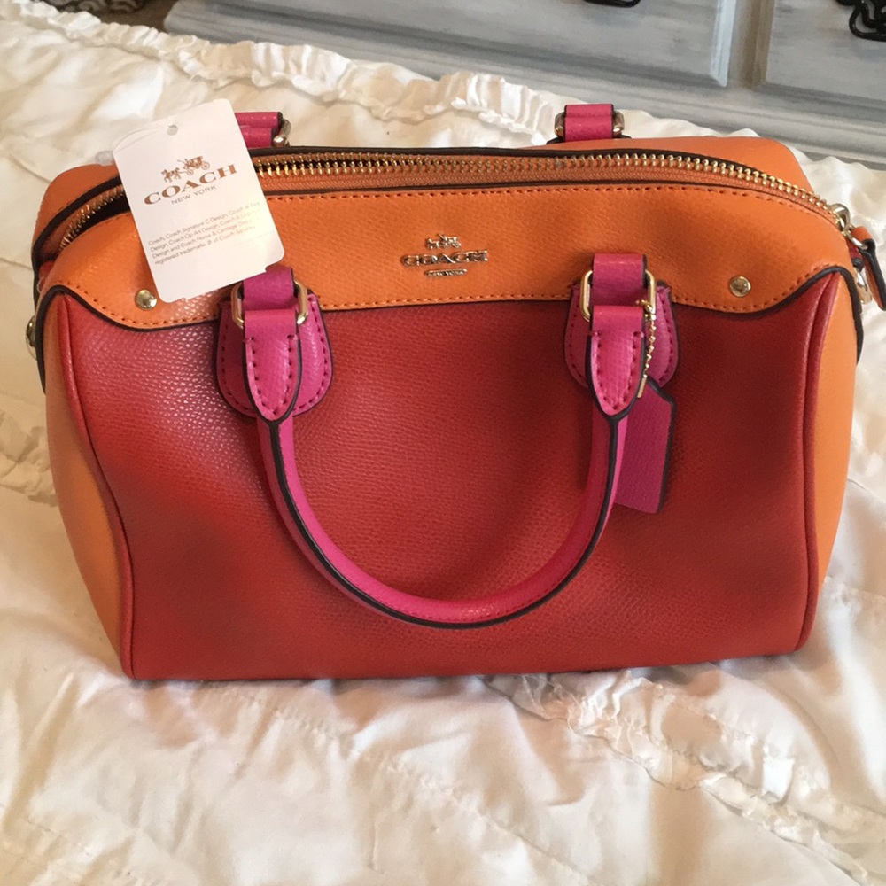 Orange and pink Coach purse